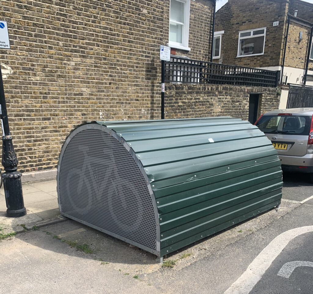 a green bike hangar in london 